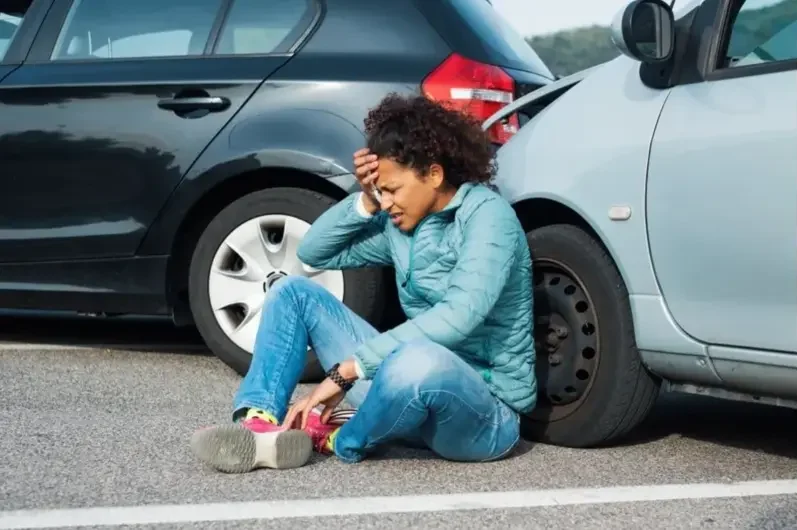 a young lady holding her head after a car crash near Lancaster, PA